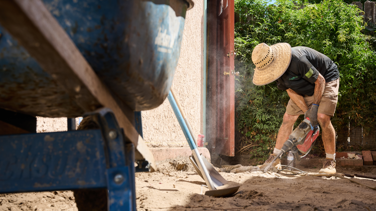 Man landscaping back yard.
